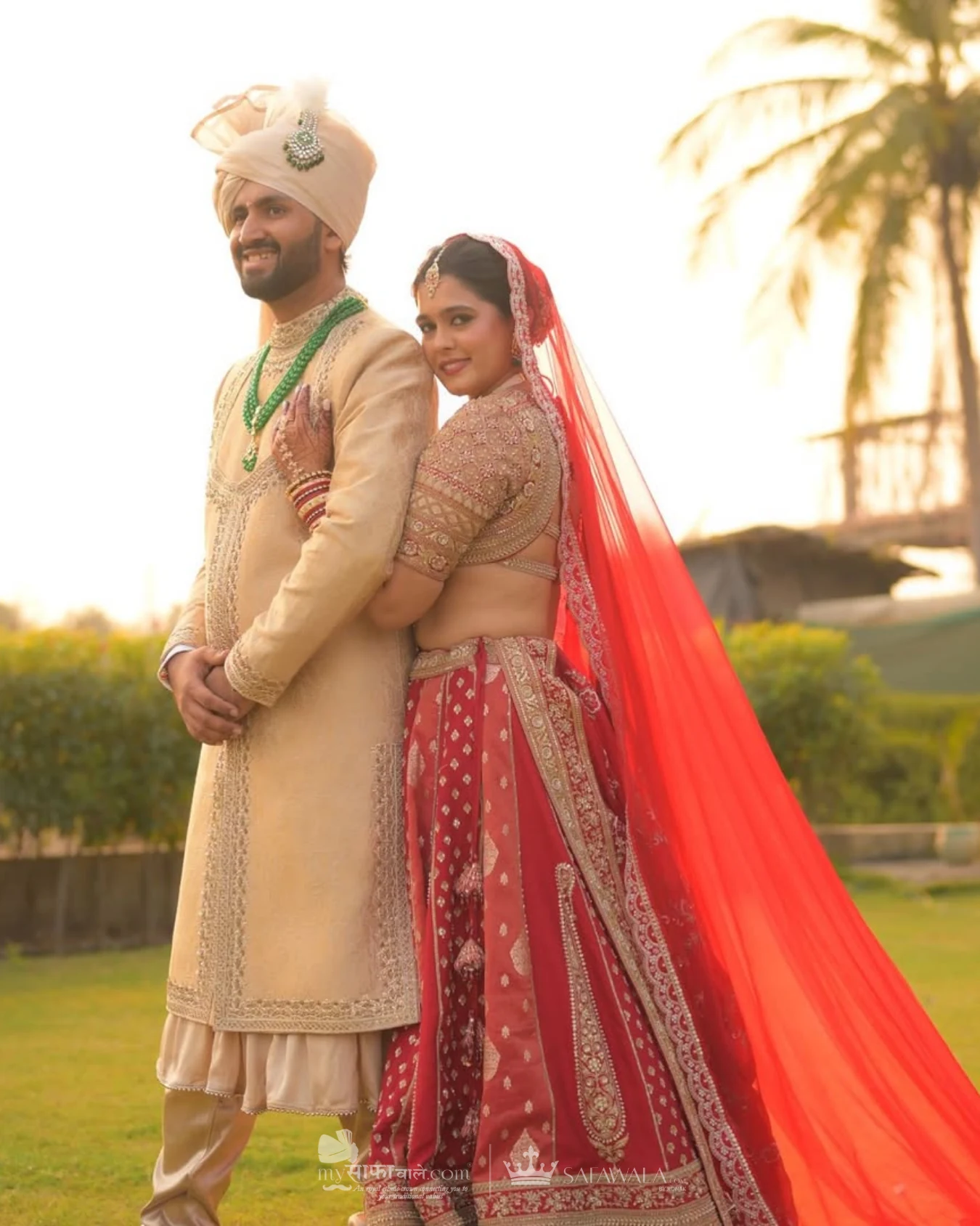 Classic groom pagdi styled with a red ceremonial stole for Family Pagdi Styling